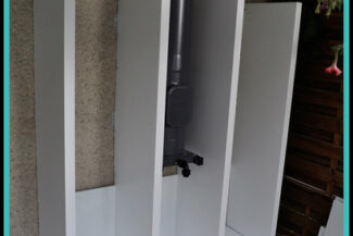 Kaminrohr Verkleidung Holzregal auf Maß im Außenbereich